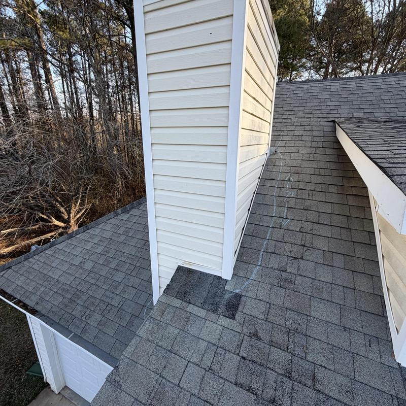 Chimney wall flashing and roof decking repair needed