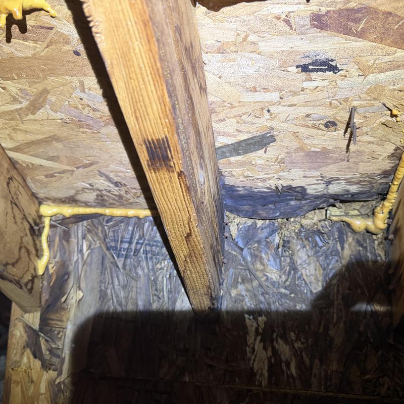 Chimney wall flashing and decking damage in attic