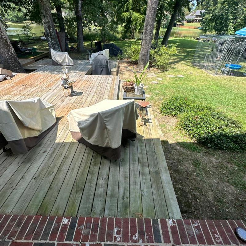Back deck wood planks and covered outdoor furniture Back deck wood planks and covered outdoor furniture