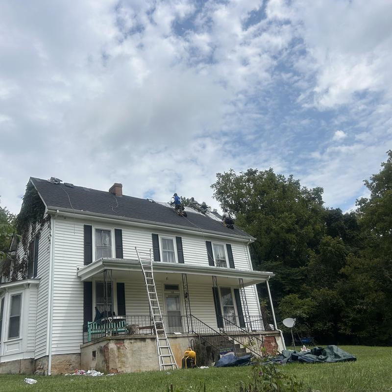 Black Shadow shingle roof with workers and ladders