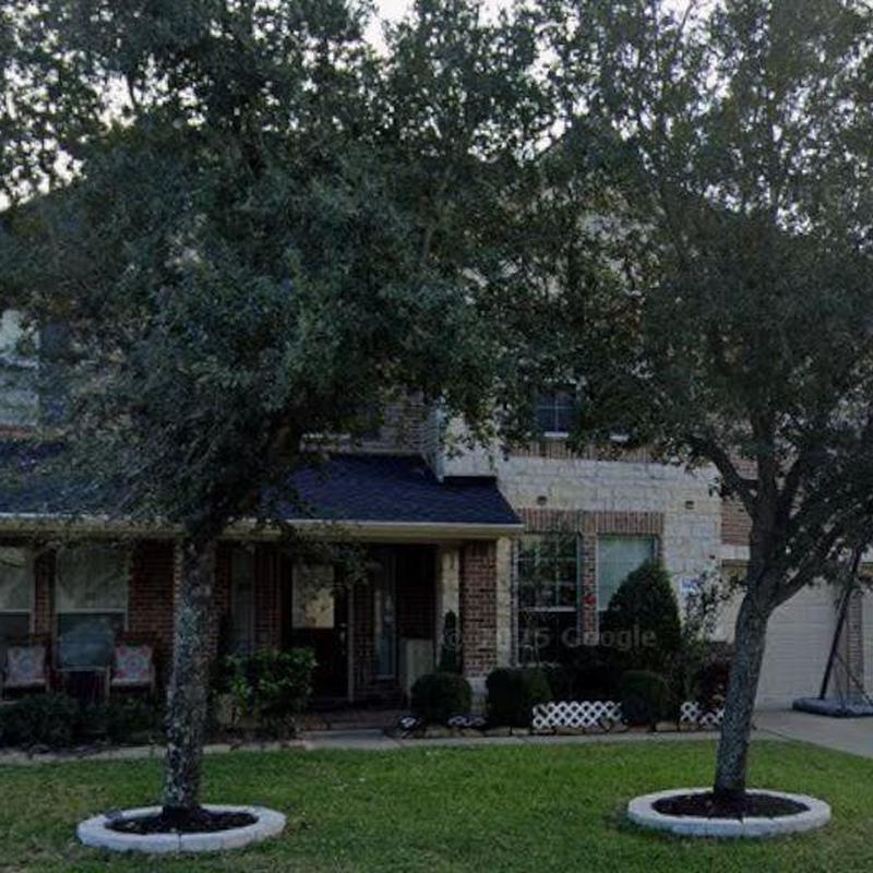 Roof shingles inspection on suburban brick house