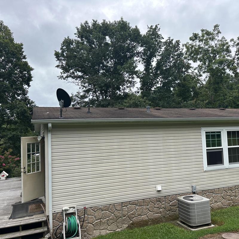 Asphalt shingle roof with satellite dish and air conditioner unit