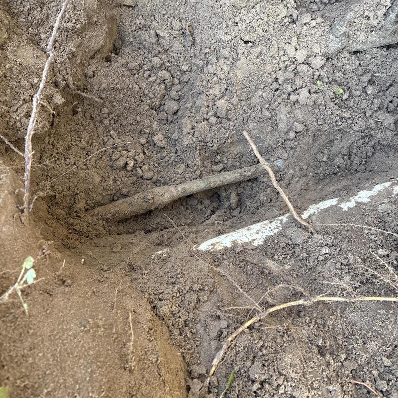 Copper water line in soil excavation site