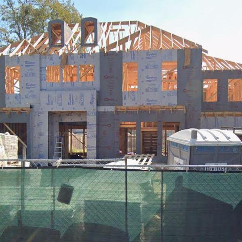 Roof framing and sheathing on house under construction