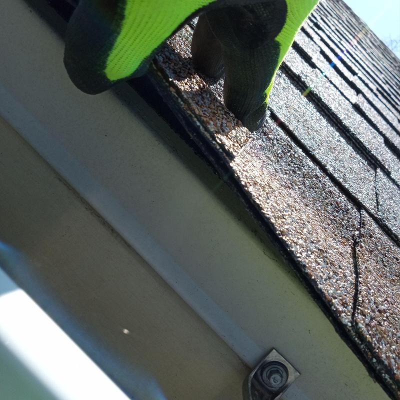 Roof shingles inspection on residential house Roof shingles inspection on residential house