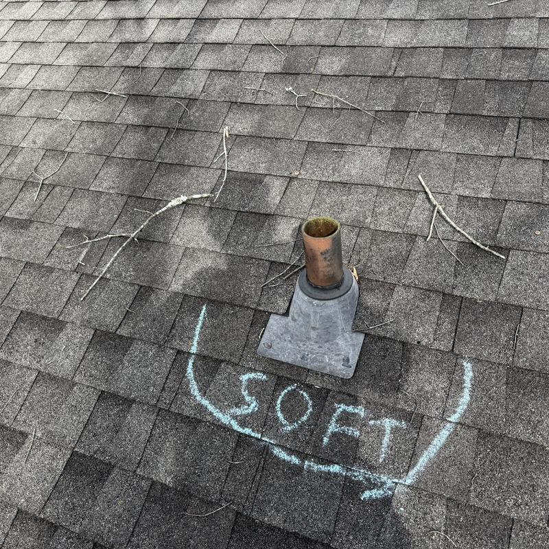 Pipe boot and roof shingles with chalk markings