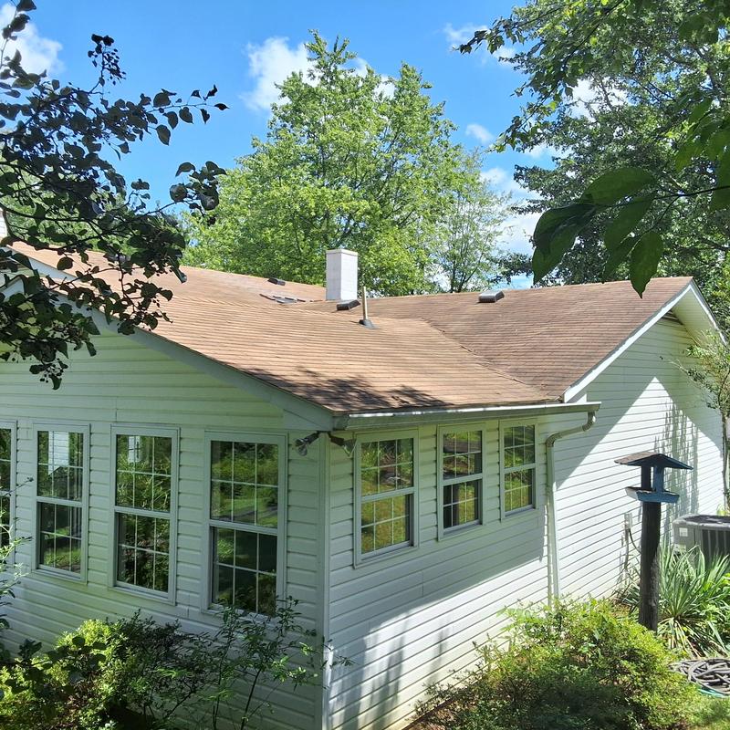 Asphalt shingle roof on residential house exterior