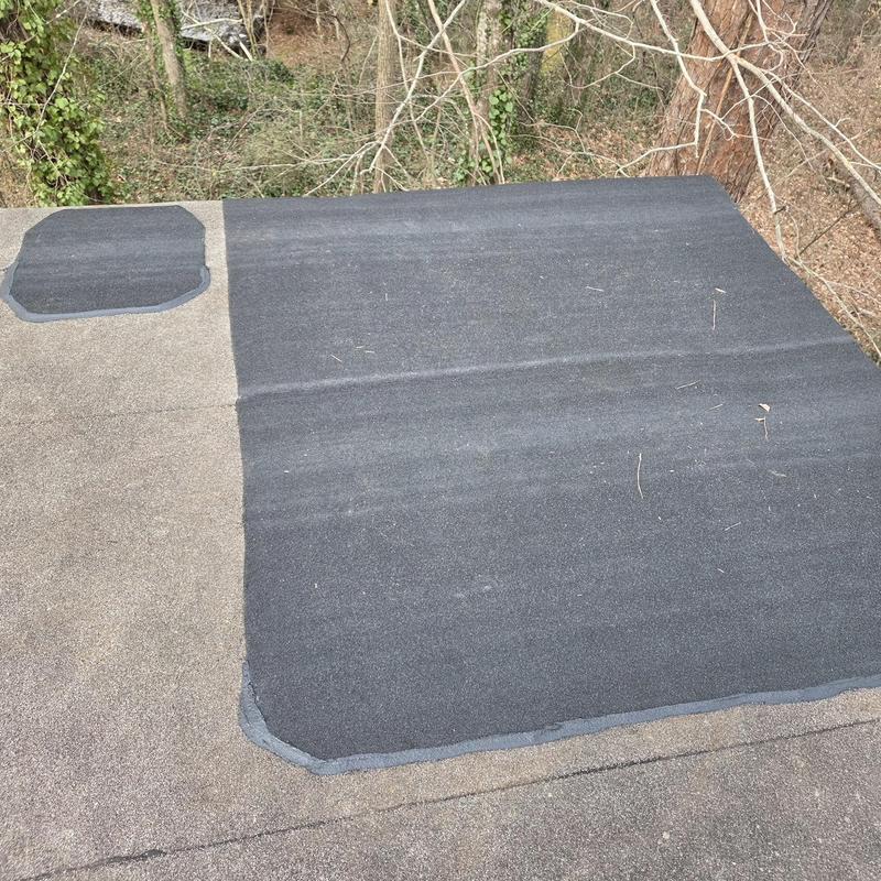 Flat roof with hot patch repair installed