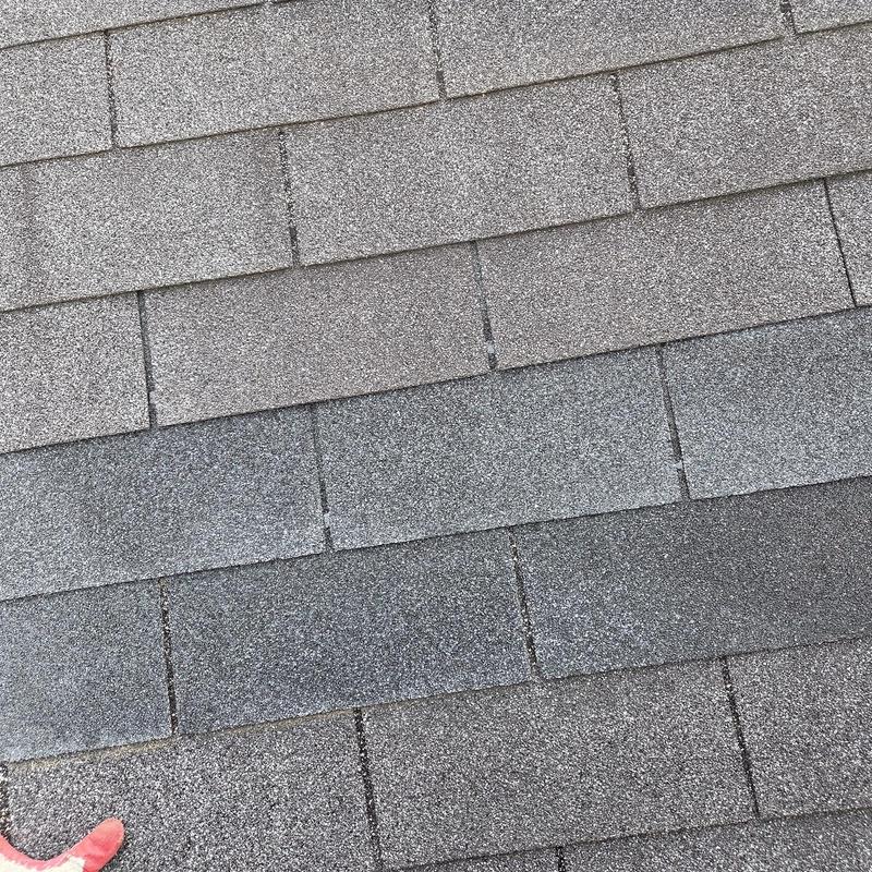 Asphalt shingles on roof after replacement and caulking