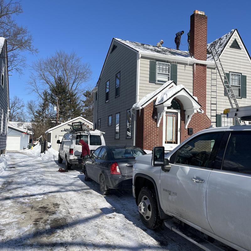 Asphalt shingle roof snow and ice removal in winter