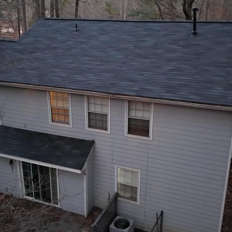 Roof with replaced decking boards and shingles in Loganville