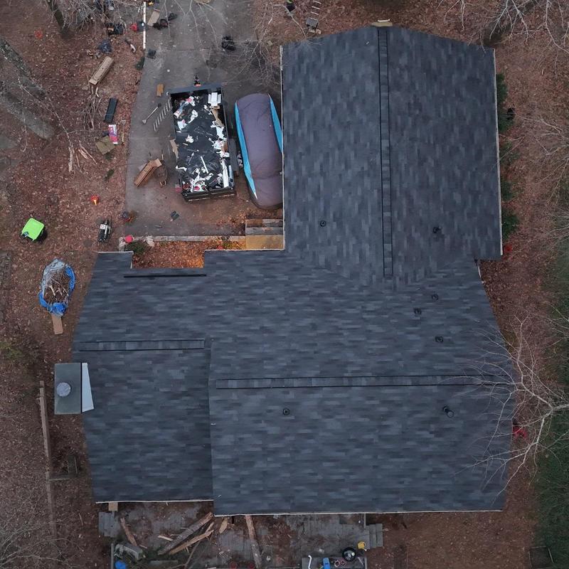 Asphalt shingle roof replacement with new decking boards
