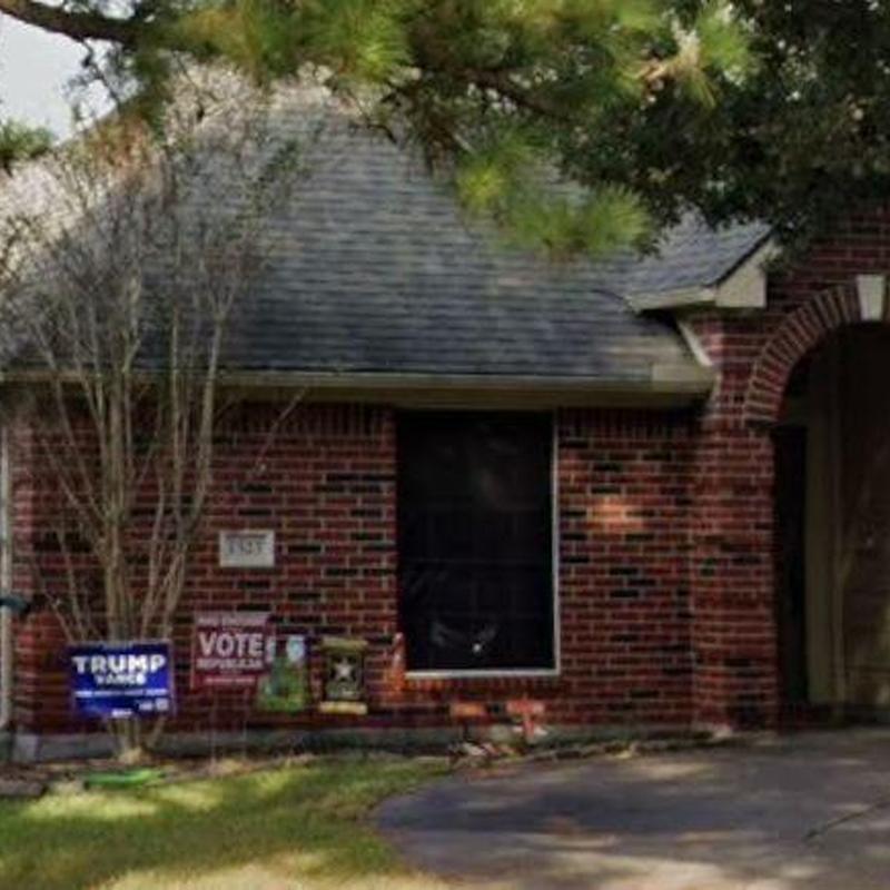 Asphalt shingle roof with brick exterior and front window