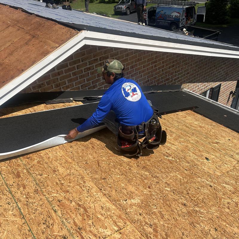Roof underlayment installation on wooden deck