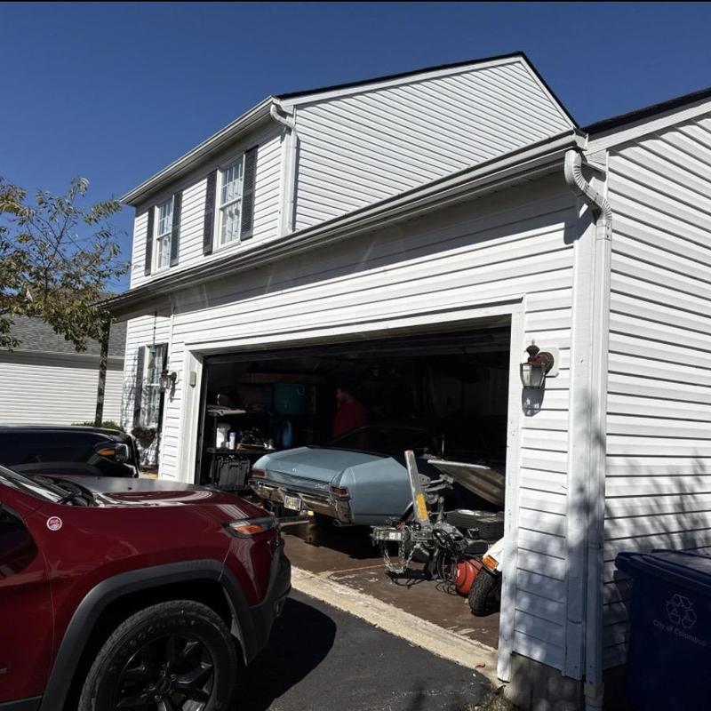 Vinyl siding on two-story garage exterior Vinyl siding on two-story garage exterior