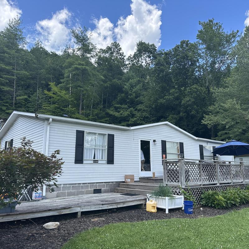 Black Shadow Shingles on white house roof