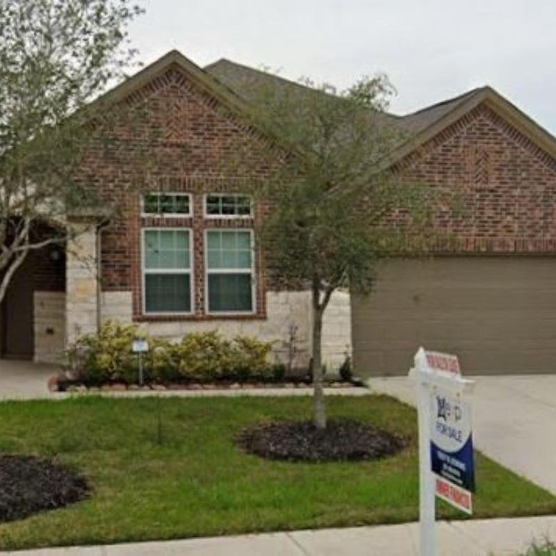 Brick exterior facade with landscaping in front yard