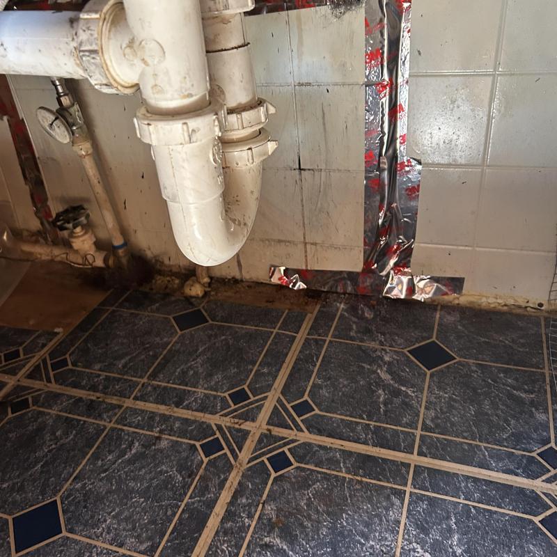 Kitchen sink drain pipe with tape seal repair