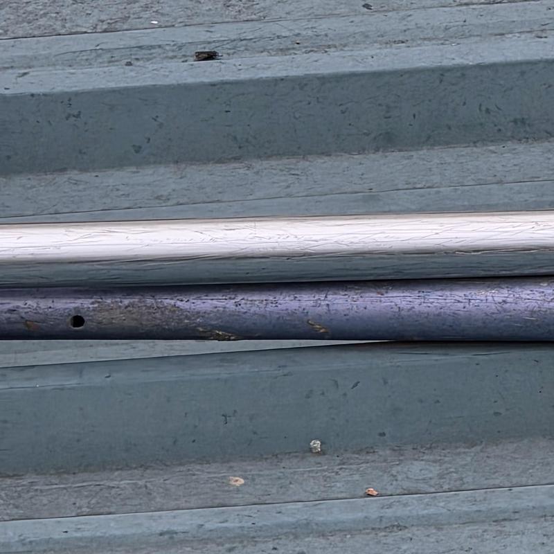 Metal roofing pipes with surface corrosion and damage