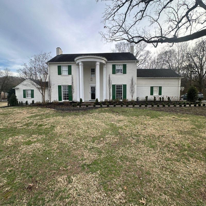 Roof shingles with hail damage inspection on house facade
