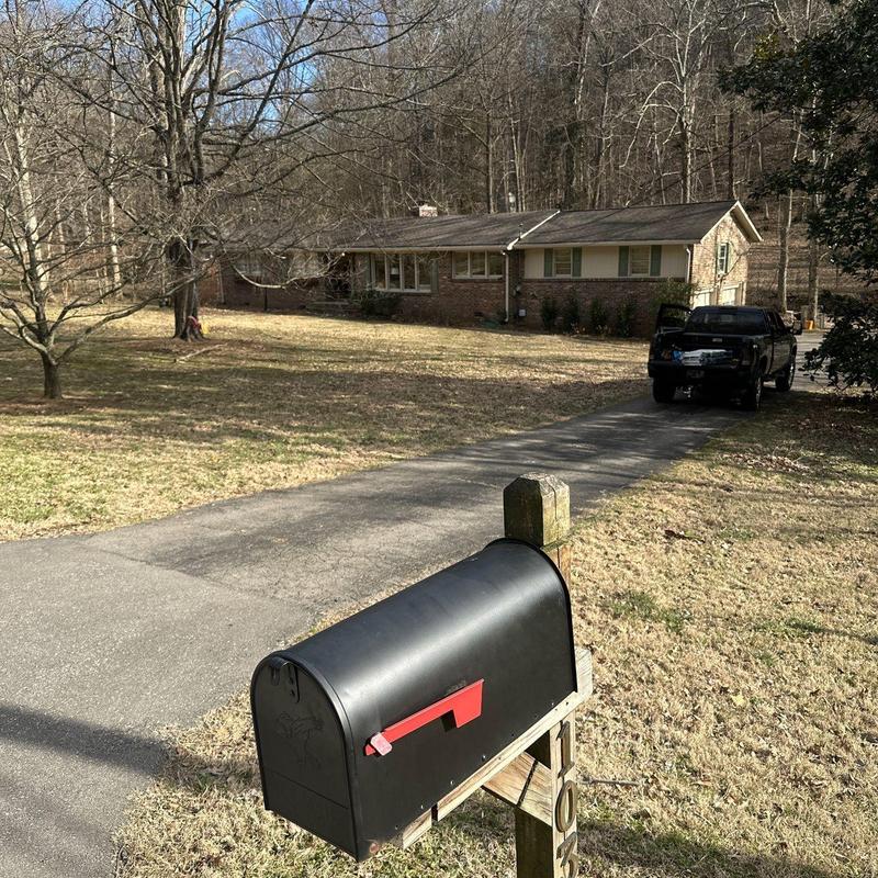Mailbox and residential driveway with pickup truck