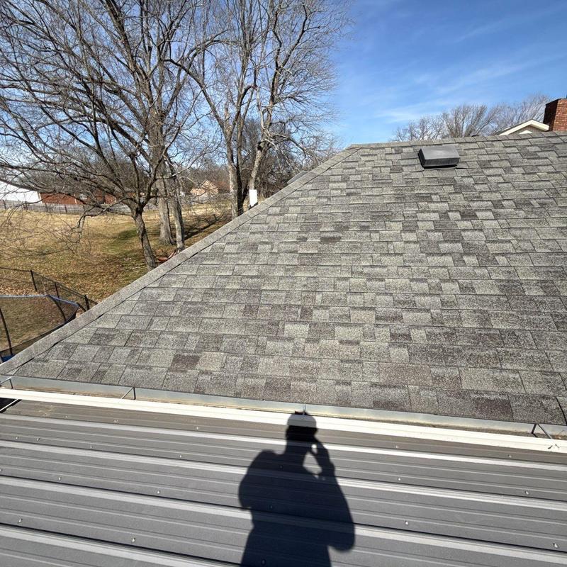 Asphalt shingle roof with hail damage inspection