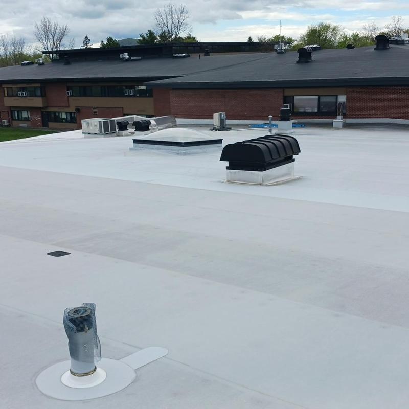 TPO roofing system on commercial school building TPO roofing system on commercial school building