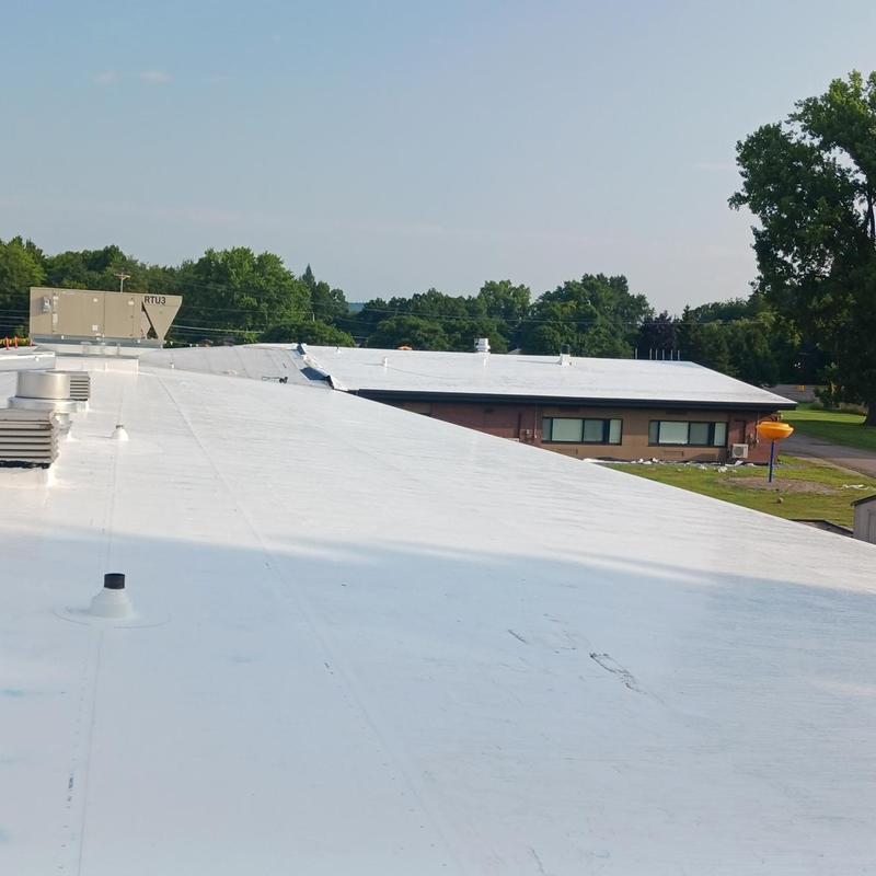 TPO roofing system on commercial school building TPO roofing system on commercial school building