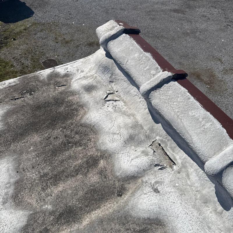 Flat roof membrane with damage and sealant issues