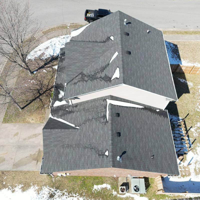Asphalt shingle roof inspection with hail damage signs