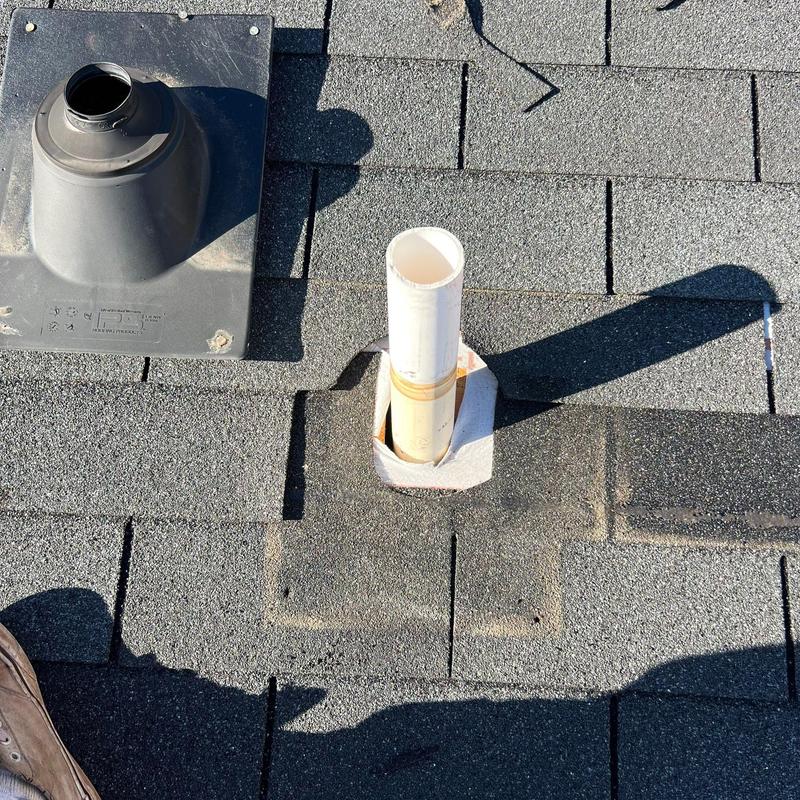 Roof vent pipe flashing on asphalt shingle roof
