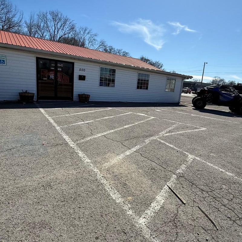 Metal roof with hail damage on commercial building