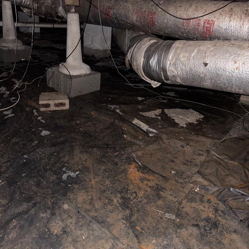 Insulated HVAC ductwork with damaged insulation wrap