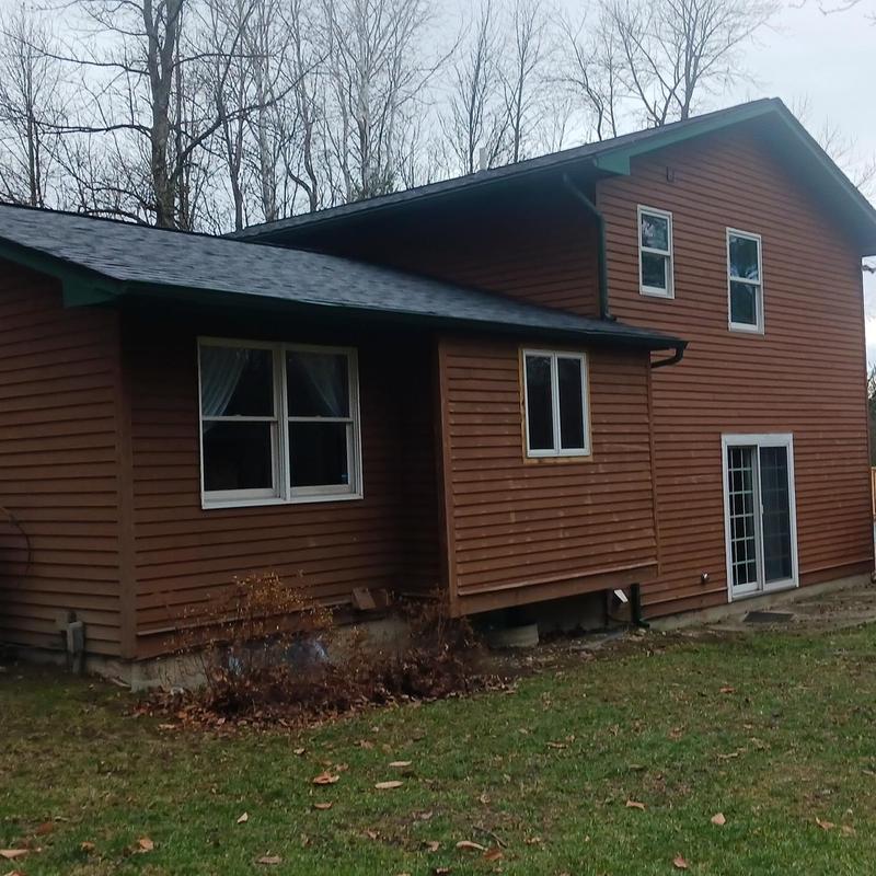 Shingle roof replacement on residential home exterior