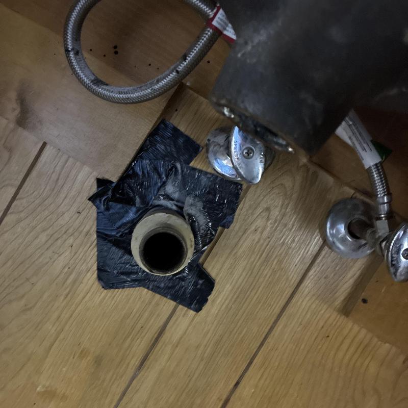 Lavatory drain pipe opening with taped base and valves