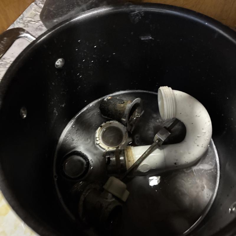 Pop-up assembly and drain parts in water bucket