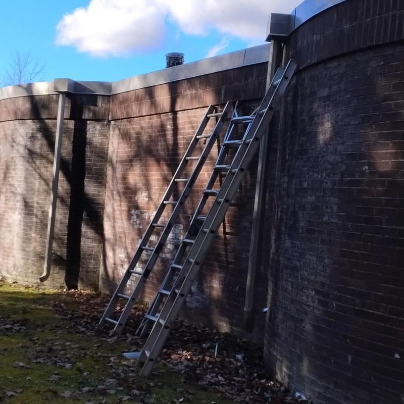 EPDM rubber roof with ladders at wastewater plant EPDM rubber roof with ladders at wastewater plant