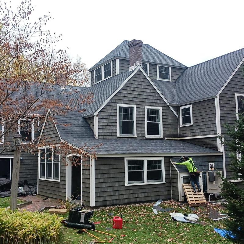 Architectural asphalt shingle roof installation on residential home