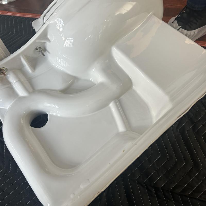 Toilet base removed for toy clog clearance