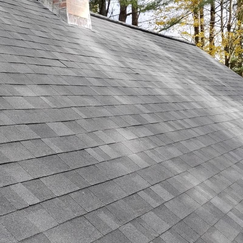 Architectural asphalt shingle roof with chimney in Vermont