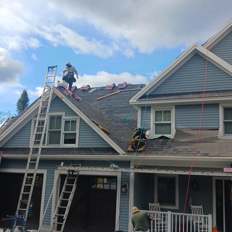 Architectural asphalt shingle roof installation on house
