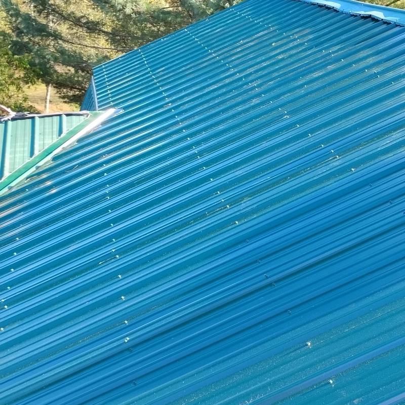 Corrugated metal roof with fasteners and flashing