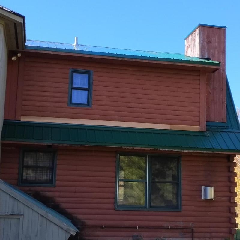 Corrugated metal roof installation on residential home