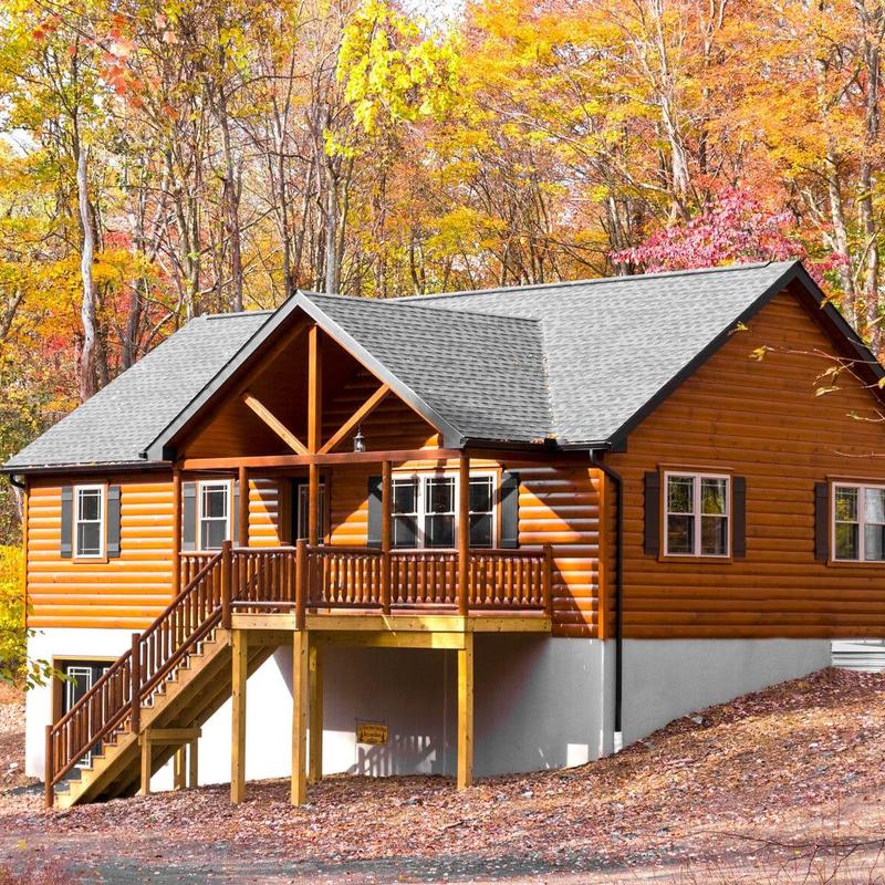 Architectural asphalt shingle roof on wood cabin