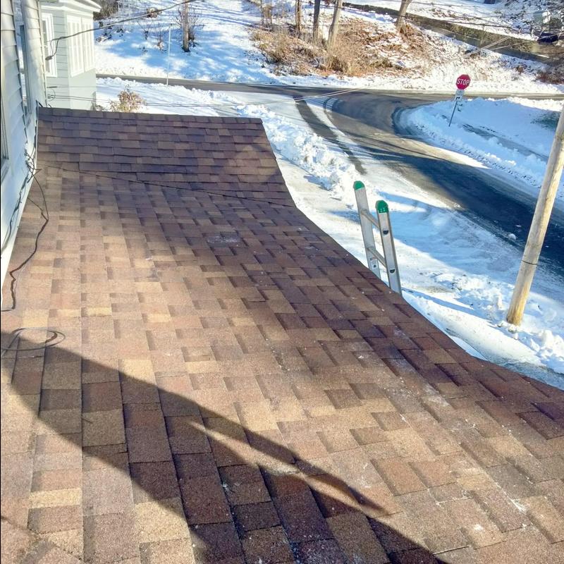 Architectural asphalt shingle roof with snow around