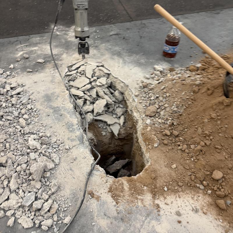 Concrete slab excavation for clogged commercial drain in Goodyear