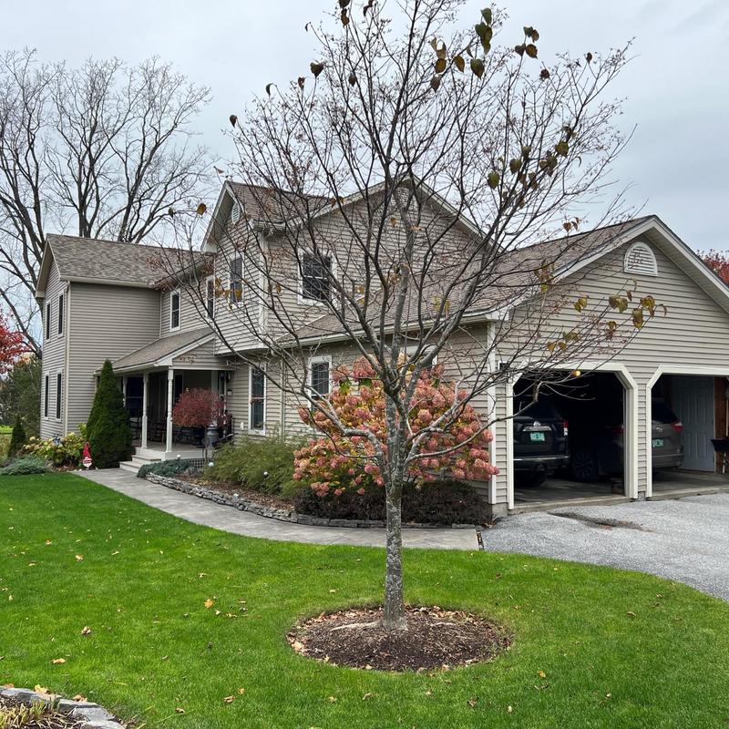 Owens Corning roof on beige two-story house