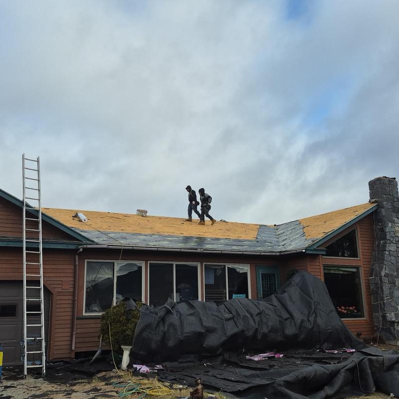 Shingle roof installation preparing wood decking on house