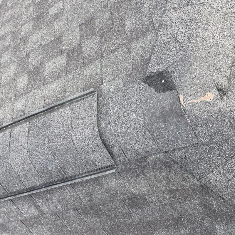 architectural asphalt shingles with damage and exposed nails