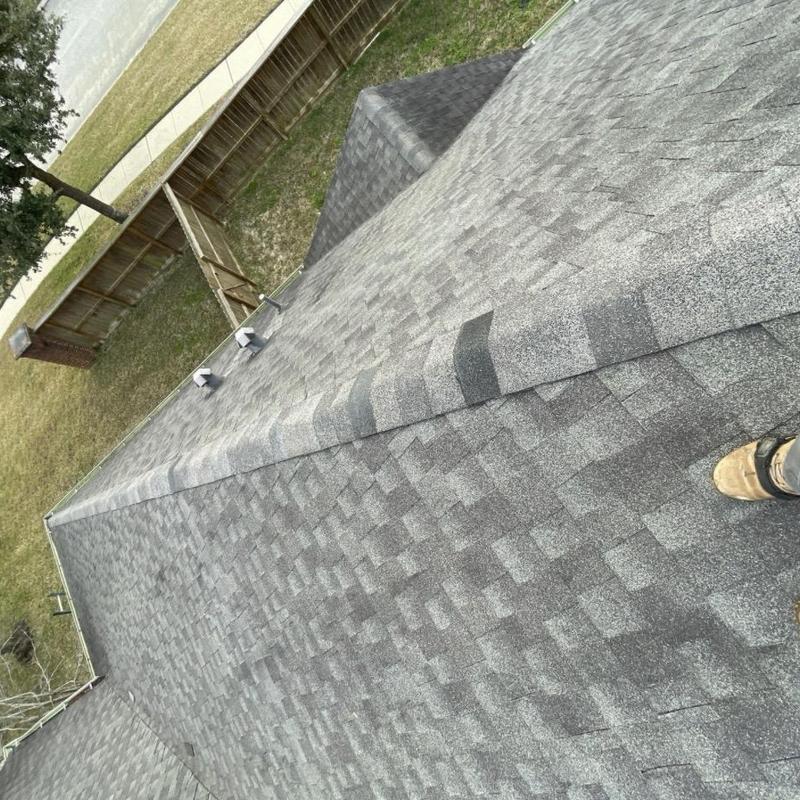 Architectural asphalt shingle roof with ridge repair